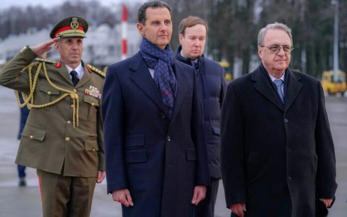 Presiden Suriah Bashar al-Assad bertemu dengan Wakil Menteri Luar Negeri Rusia Mikhail Bogdanov setibanya di Bandara Internasional Vnukovo di Moskow, Rusia dalam foto yang diperoleh Reuters pada 14 Maret 2023. Foto: SANA/HO/Reuters.