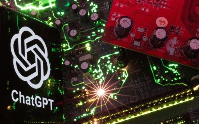 Ponsel cerdas dengan logo ChatGPT yang ditampilkan ditempatkan pada motherboard komputer dalam ilustrasi yang diambil 23 Februari 2023. Foto: Reuters/Dado Ruvic/Illustration.